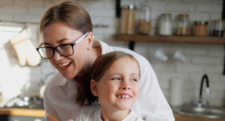 A parent and child reading the report together